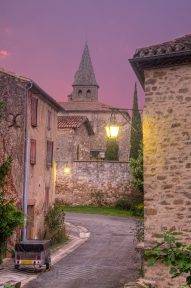rose and pink dawn sky with church and village scene